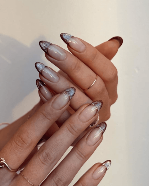 Close up of brown and glittery Velvet french nails
